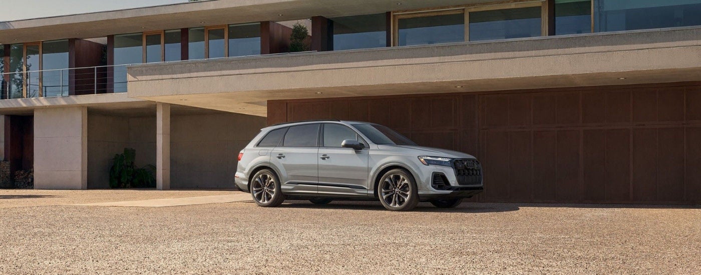 A silver 2025 Audi Q7 parked on a driveway.